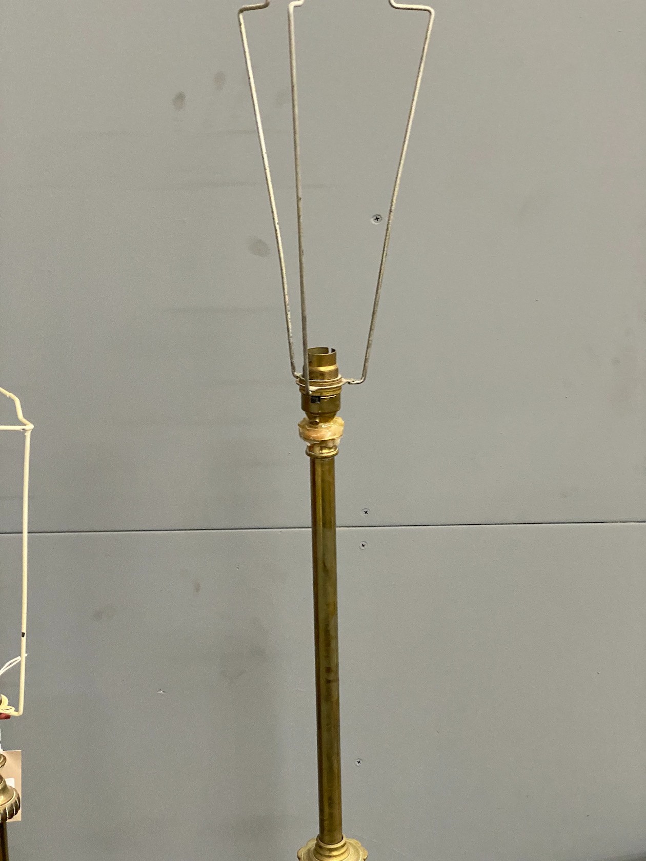 Two Edwardian brass telescopic standard lamps.